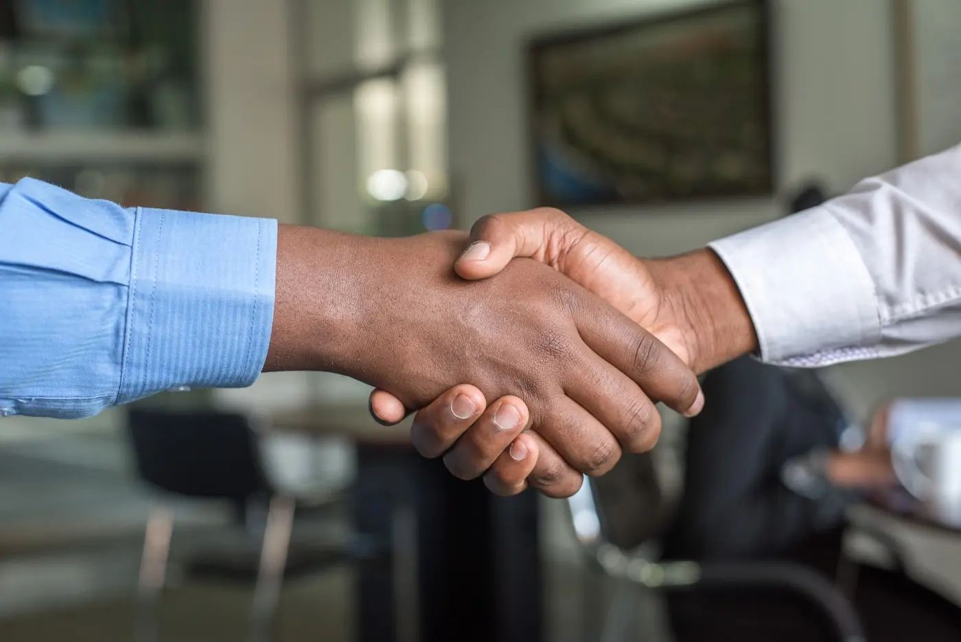 A handshake between a Fort Worth business owner and their lending advisor