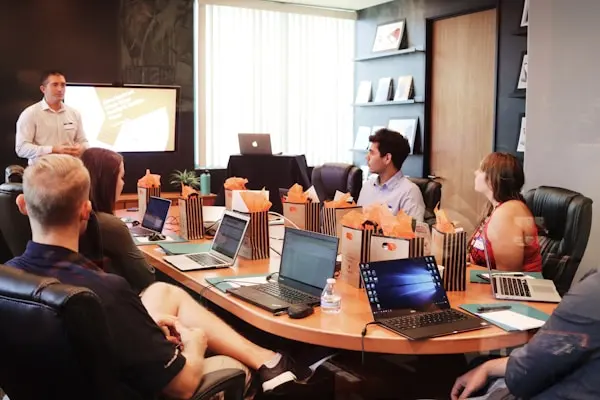 Advisors reviewing documents in a meeting